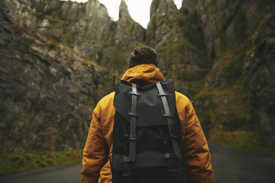 Back of man with backpack