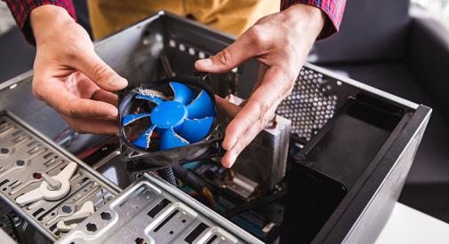 Dirt computer fan being cleaned