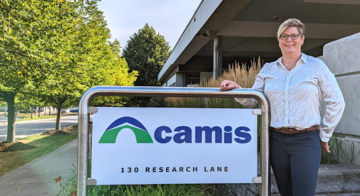 New CEO Kim Mackie with Camis sign